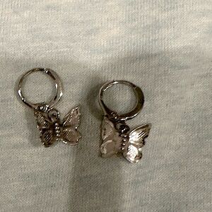 Silver butterfly earrings.